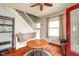 Cozy living room featuring hardwood floors, staircase with seating and a view of the front porch at 616 N Bancroft St, Indianapolis, IN 46201