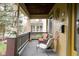 Inviting front porch with comfortable seating, classic decor, and views of the neighborhood street at 616 N Bancroft St, Indianapolis, IN 46201