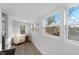 Bright bonus room with vinyl floors, chair, and lots of windows at 625 N Parker Ave, Indianapolis, IN 46201