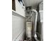 Close-up of a water heater and furnace setup in a utility space at 640 W South St, Shelbyville, IN 46176