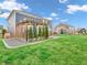 Spacious backyard with lush lawn, elegant patio and pergola, ideal for relaxing or entertaining guests at 682 Keswick Dr, Brownsburg, IN 46112