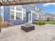 This home has a concrete backyard patio with modern fire pit and steps to the home at 682 Keswick Dr, Brownsburg, IN 46112