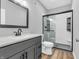 Modern bathroom featuring sleek fixtures, glass-enclosed shower, and vanity, creating a contemporary space at 682 Keswick Dr, Brownsburg, IN 46112