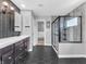Bathroom features sleek vanity, tiled walk-in shower, and black accents for modern style at 682 Keswick Dr, Brownsburg, IN 46112