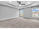 Spacious bedroom with tray ceiling and windows for plenty of natural light at 682 Keswick Dr, Brownsburg, IN 46112