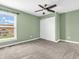 Bedroom with pale green walls, carpet, window and closet with sliding doors at 682 Keswick Dr, Brownsburg, IN 46112