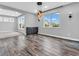Dining area features wood floors, stylish lighting, and view of the manicured lawn at 682 Keswick Dr, Brownsburg, IN 46112