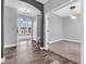 Elegant foyer featuring hardwood floors, arched doorway, and abundant natural light, creating a welcoming ambiance at 682 Keswick Dr, Brownsburg, IN 46112