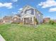 Beautiful two-story home with brick and siding, landscaped yard, and inviting front porch at 682 Keswick Dr, Brownsburg, IN 46112