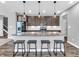 Stylish kitchen with granite countertops, stainless appliances, and pendant lighting at 682 Keswick Dr, Brownsburg, IN 46112