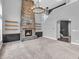 Cozy living room featuring a stone fireplace, built-in shelving, and ample space for relaxation and entertainment at 682 Keswick Dr, Brownsburg, IN 46112