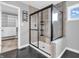 Modern bathroom with tiled shower and glass door next to the walk-in closet at 682 Keswick Dr, Brownsburg, IN 46112