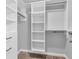 Walk-in closet with custom shelving and drawers for ample storage at 682 Keswick Dr, Brownsburg, IN 46112
