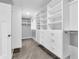 Spacious walk-in closet with custom shelving and drawers for ample storage at 682 Keswick Dr, Brownsburg, IN 46112