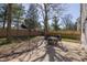 Backyard patio featuring an outdoor table and chair set with a wood fence surround at 6853 Bretton Wood Dr, Indianapolis, IN 46268
