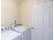 Practical laundry room featuring washer and dryer hookups and ample space for laundry tasks at 6853 Bretton Wood Dr, Indianapolis, IN 46268