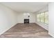 Bright living room features a fireplace and large window providing lots of natural light at 6853 Bretton Wood Dr, Indianapolis, IN 46268