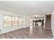 Open concept living space with new flooring, a staircase, and views into the modern kitchen at 6853 Bretton Wood Dr, Indianapolis, IN 46268