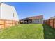 Spacious backyard featuring a fenced yard and a covered patio at 6953 Beargrass Ct, Indianapolis, IN 46241