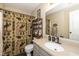 Bathroom featuring granite vanity and a novelty shower curtain at 6953 Beargrass Ct, Indianapolis, IN 46241