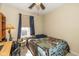 Bright secondary bedroom with ceiling fan and natural light at 6953 Beargrass Ct, Indianapolis, IN 46241
