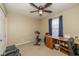 Bedroom features a ceiling fan and a built-in workstation at 6953 Beargrass Ct, Indianapolis, IN 46241