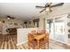 Charming dining area with wood table, chairs, and natural light, adjacent to the living area at 6953 Beargrass Ct, Indianapolis, IN 46241