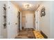 Welcoming entryway with wood flooring, bench, and decorative wall art at 6953 Beargrass Ct, Indianapolis, IN 46241