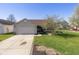 Charming one-story home with a two-car garage and well-maintained front lawn at 6953 Beargrass Ct, Indianapolis, IN 46241