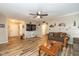 Inviting living room with wood flooring, a large TV, and rustic decor at 6953 Beargrass Ct, Indianapolis, IN 46241