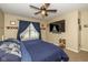 Serene main bedroom with carpet, a ceiling fan, and natural light from the window at 6953 Beargrass Ct, Indianapolis, IN 46241