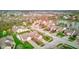 Aerial view of the community showcasing the neighborhood layout, homes, and a nearby pond at 7150 Brant Pointe Cir, Indianapolis, IN 46217
