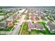 An aerial view showcasing homes with manicured lawns lining tree-lined streets surrounding a cul-de-sac at 7150 Brant Pointe Cir, Indianapolis, IN 46217