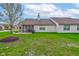 Green backyard featuring a screened porch and patio space at 7150 Brant Pointe Cir, Indianapolis, IN 46217