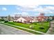A beautifully maintained backyard with lush lawn and screened porch is pictured in a residential neighborhood at 7150 Brant Pointe Cir, Indianapolis, IN 46217