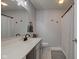 Bright bathroom featuring a shower with black-and-white curtain and long vanity at 7150 Brant Pointe Cir, Indianapolis, IN 46217