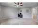 This spacious bedroom offers plush neutral carpet, a ceiling fan, and plenty of natural light at 7150 Brant Pointe Cir, Indianapolis, IN 46217