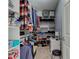Organized walk-in closet with shelving, hanging space, and storage solutions for clothes and accessories at 7150 Brant Pointe Cir, Indianapolis, IN 46217
