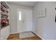 Bright entryway with wood floors, coat closet, and decorated built-in shelving at 7150 Brant Pointe Cir, Indianapolis, IN 46217