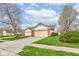 Well-maintained single-story home with attached two-car garage and landscaped lawn at 7150 Brant Pointe Cir, Indianapolis, IN 46217