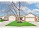 Charming single story home featuring a two-car garage and well-manicured lawn at 7150 Brant Pointe Cir, Indianapolis, IN 46217