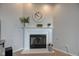 Close-up of a cozy fireplace with white mantel and decorative accents at 7150 Brant Pointe Cir, Indianapolis, IN 46217
