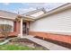 Inviting front entrance with brick accents, a 'Welcome' sign, and tidy landscaping at 7150 Brant Pointe Cir, Indianapolis, IN 46217