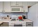 Close up of the kitchen appliances, including a microwave and gas range at 7150 Brant Pointe Cir, Indianapolis, IN 46217