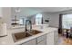 A kitchen sink with stainless steel appliances and a view to another room at 7150 Brant Pointe Cir, Indianapolis, IN 46217