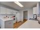 Bright kitchen featuring white cabinets, a gas range, and ample counter space at 7150 Brant Pointe Cir, Indianapolis, IN 46217
