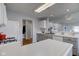 Spacious kitchen with white countertops, stainless steel appliances, and gray cabinetry at 7150 Brant Pointe Cir, Indianapolis, IN 46217