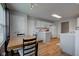 A view of the kitchen and dining area showcasing the open layout with white cabinets at 7150 Brant Pointe Cir, Indianapolis, IN 46217
