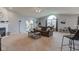 Bright and airy living room with fireplace, ceiling fan and sliding glass door to patio at 7150 Brant Pointe Cir, Indianapolis, IN 46217
