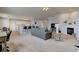 Spacious living room leading to kitchen and dining area, featuring a fireplace at 7150 Brant Pointe Cir, Indianapolis, IN 46217
